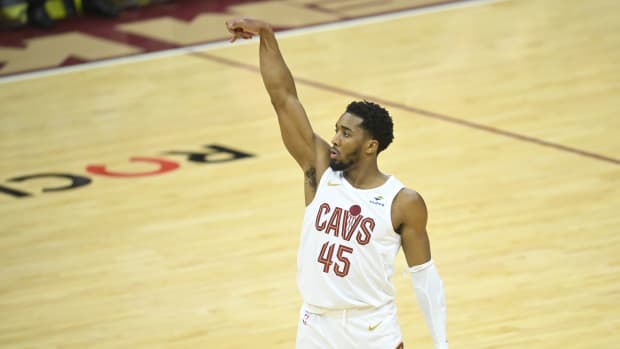 Feb 5, 2024; Cleveland, Ohio, USA; Cleveland Cavaliers guard Donovan Mitchell (45) watches his three-point basket in the third quarter against the Sacramento Kings at Rocket Mortgage FieldHouse. Mandatory Credit: David Richard-USA TODAY Sports